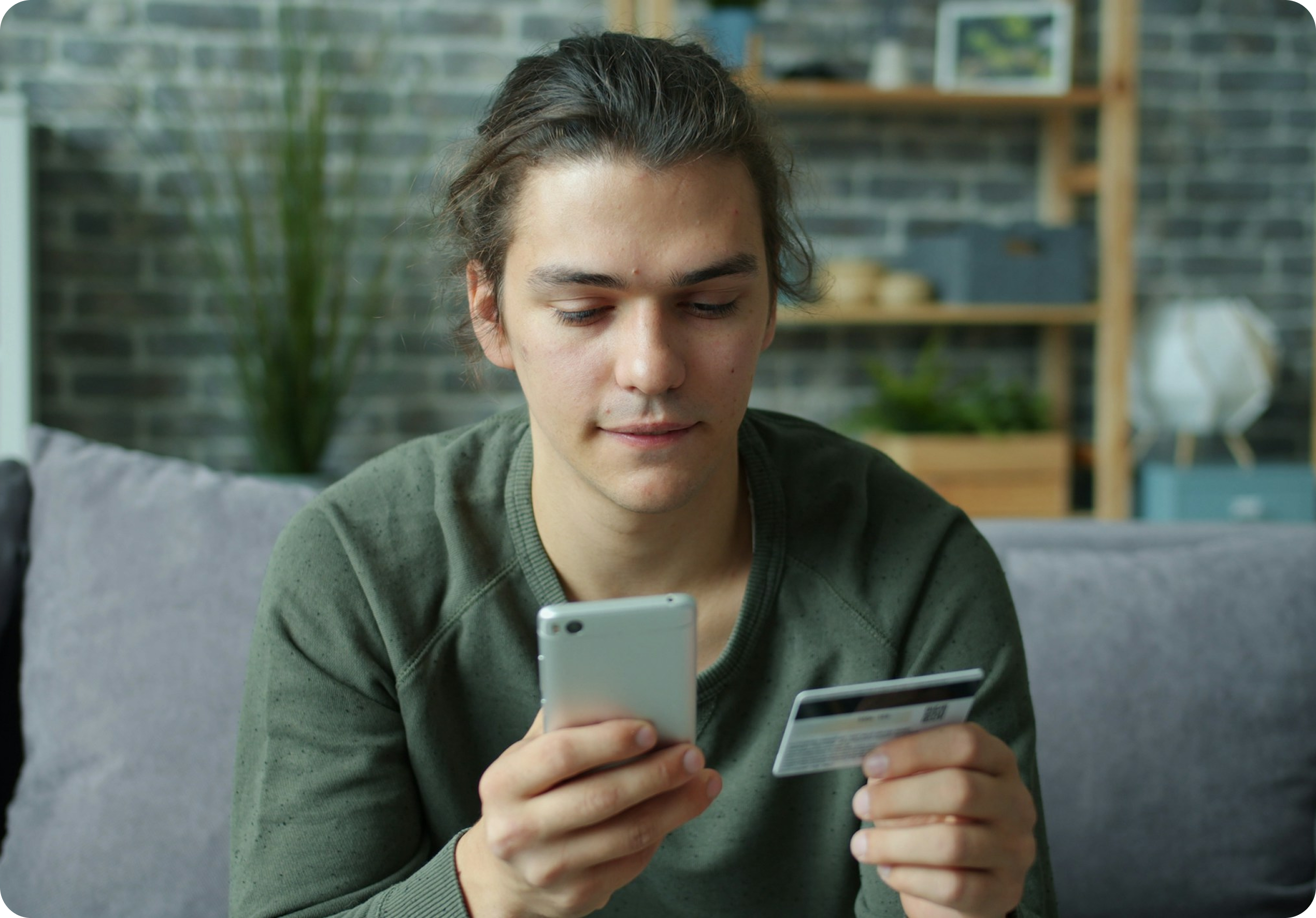 Person using phone and card for payment